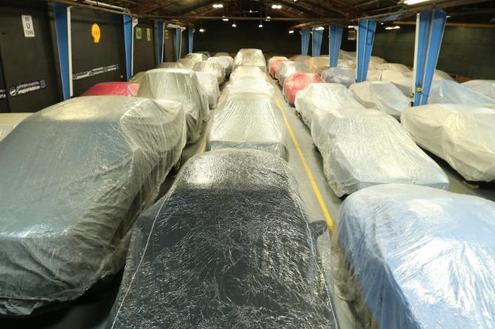 Covered cars being stored